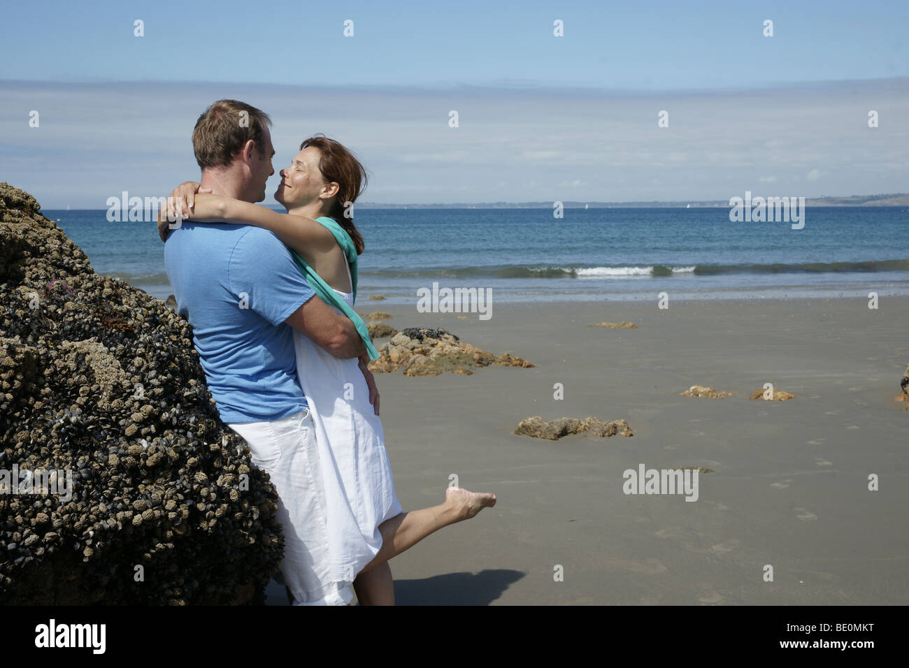 Couple in love kissing against the light hi-res stock photography and ...
