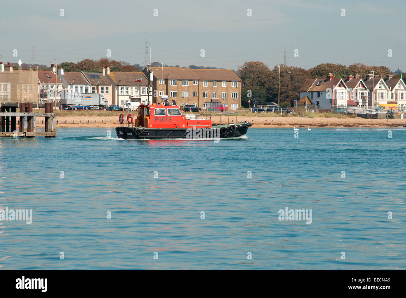 Shoreham harbour pilot vessel leaving port to guide in a large
