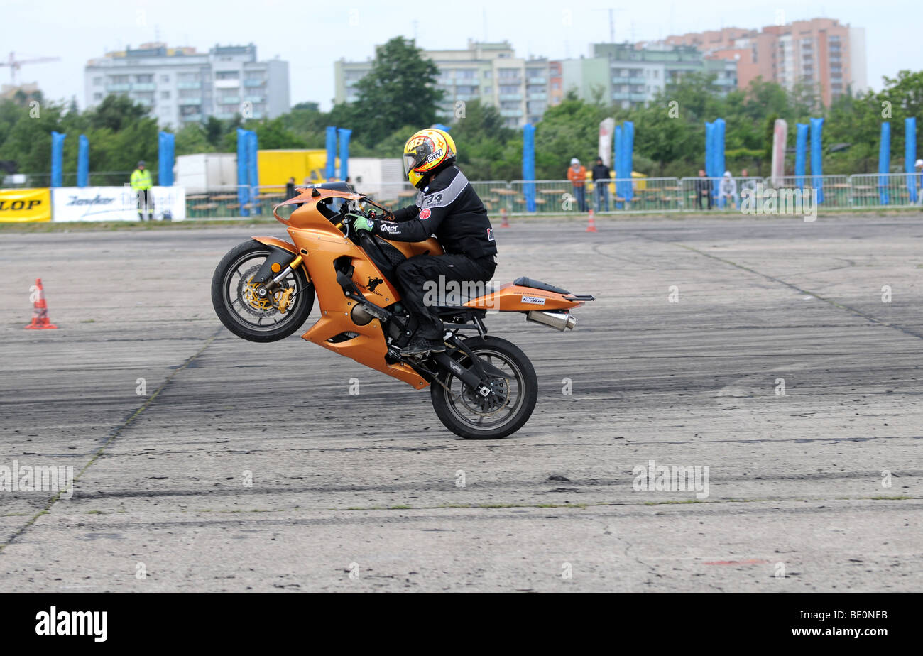 Streetbike freestyle stunt riders show in Warsaw, Poland - man riding on  rear wheel Stock Photo - Alamy