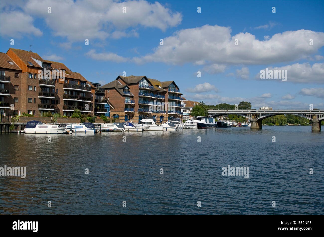 Modern Apartments and Riverside Moorings On The River Thames Hampton Wick Surrey England Stock Photo