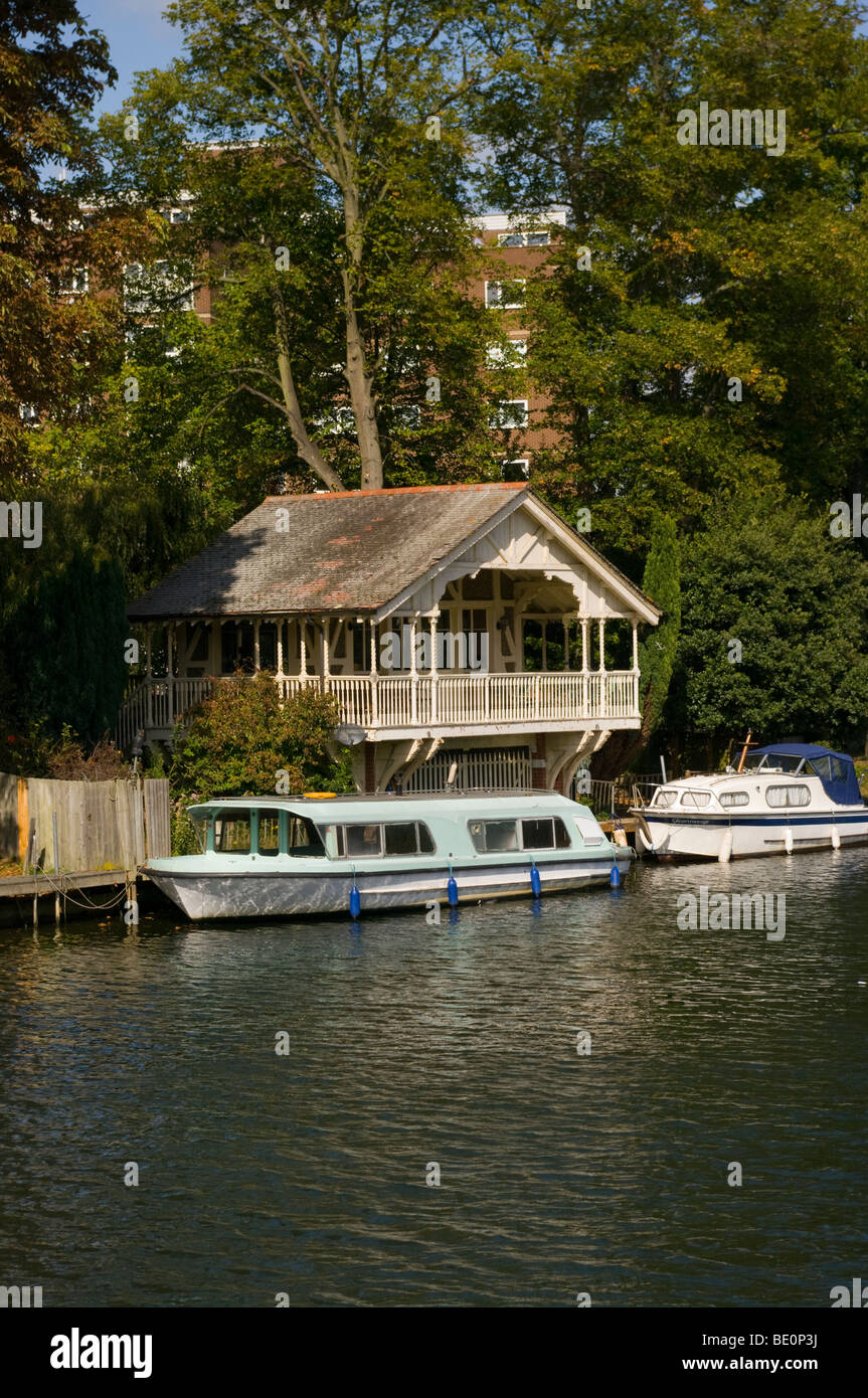 A Riverside Boathouse And Moored Boats On The River Thames at