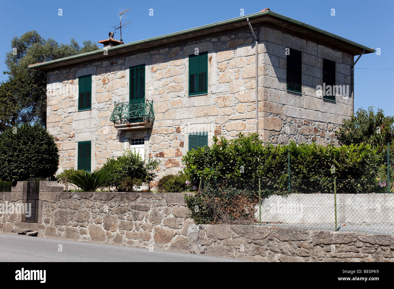 Typical Minho Region House made of granite stone in Vila Nova de Famalicão, Braga District Portugal. Stock Photo
