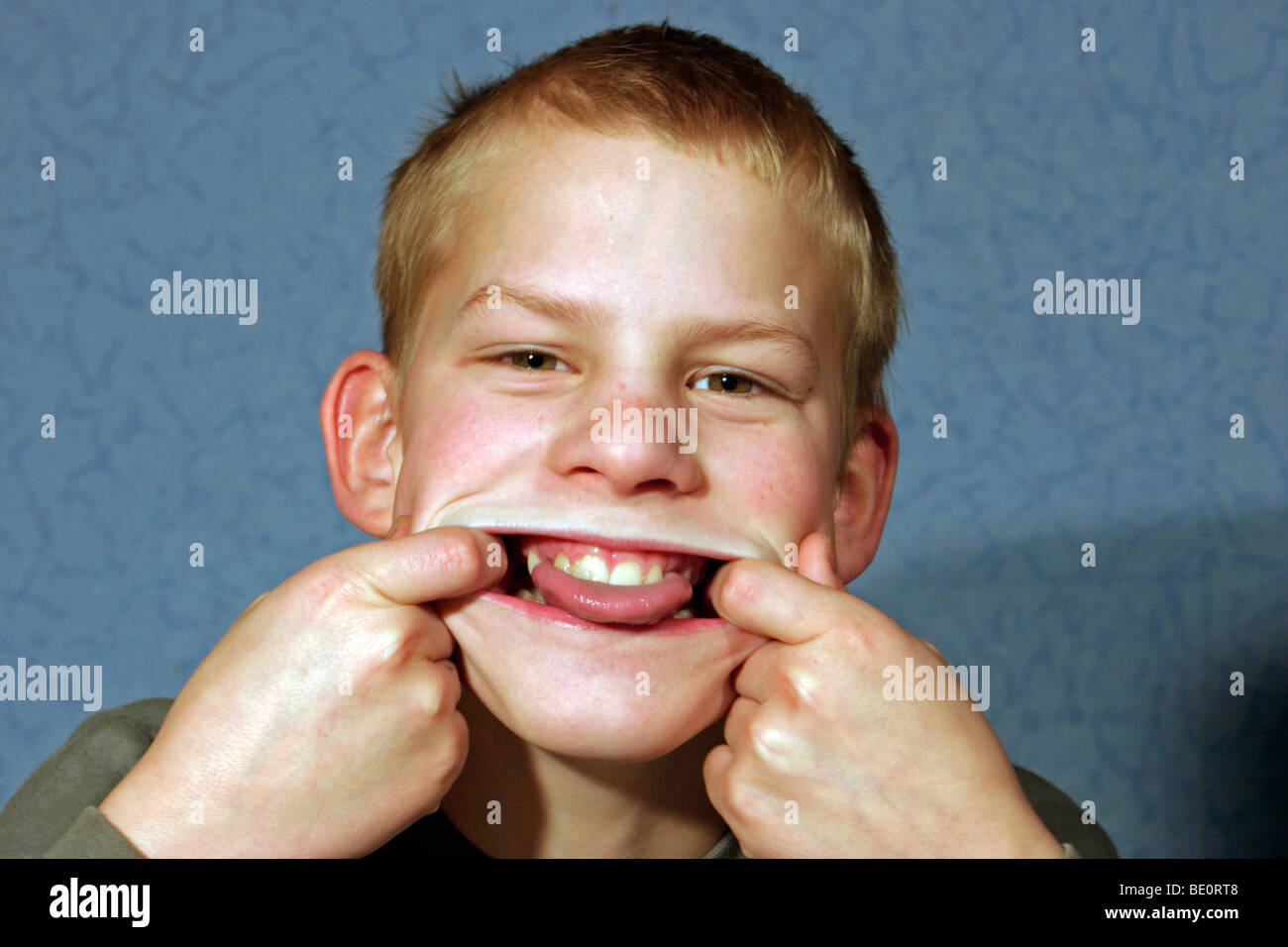 young boy making a grimace Stock Photo