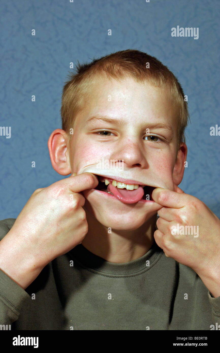 young boy making a grimace Stock Photo
