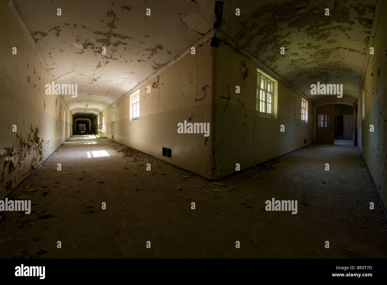 A split corridor in the derelict Severalls Psychiatric Hospital, Colchester, UK Stock Photo