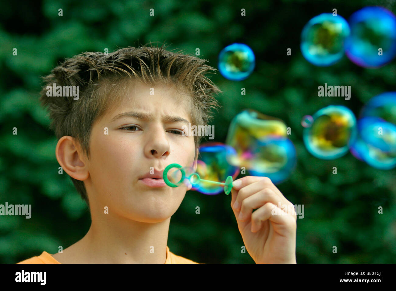 young boy making soap bubbles Stock Photo Alamy
