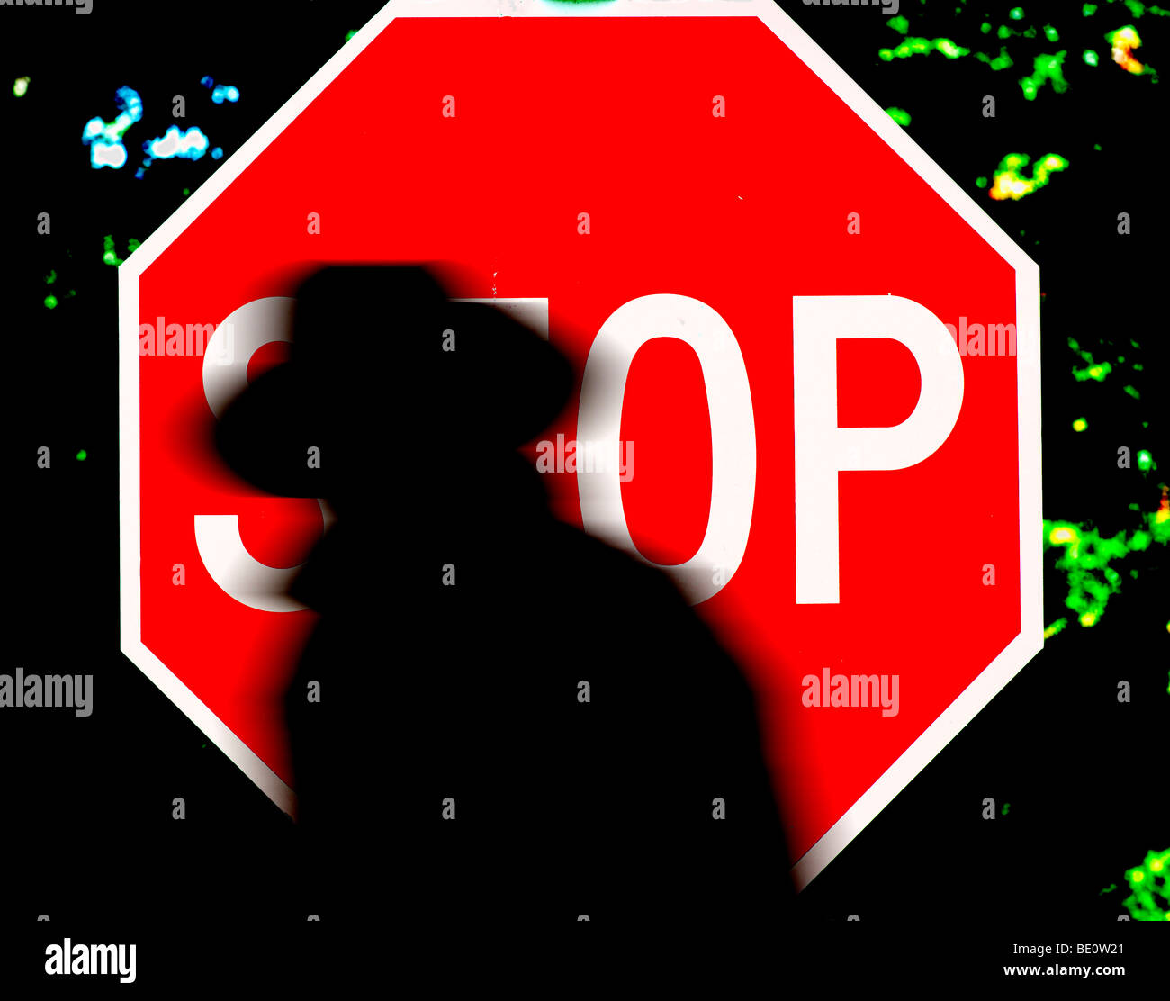 bad guy silhouette stop sign Stock Photo