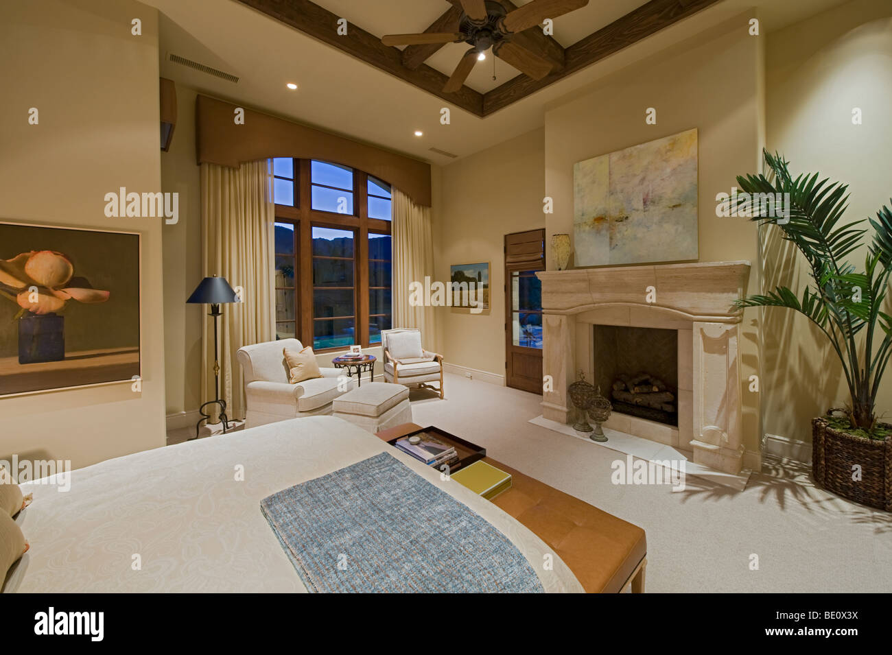 Elegant Residential Bedroom Suite With Wood Beamed Ceiling And Large Window Showing Night Sky Stock Photo Alamy