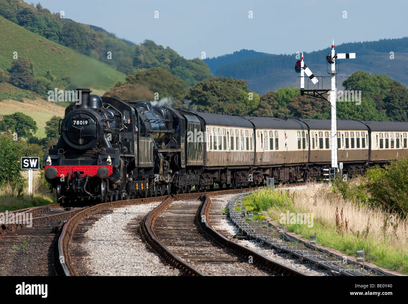 Steam Locomotive 78019 approaches Carrog Station at the end of it's journey from Llangollen on the Llangollen Steam Railway Stock Photo