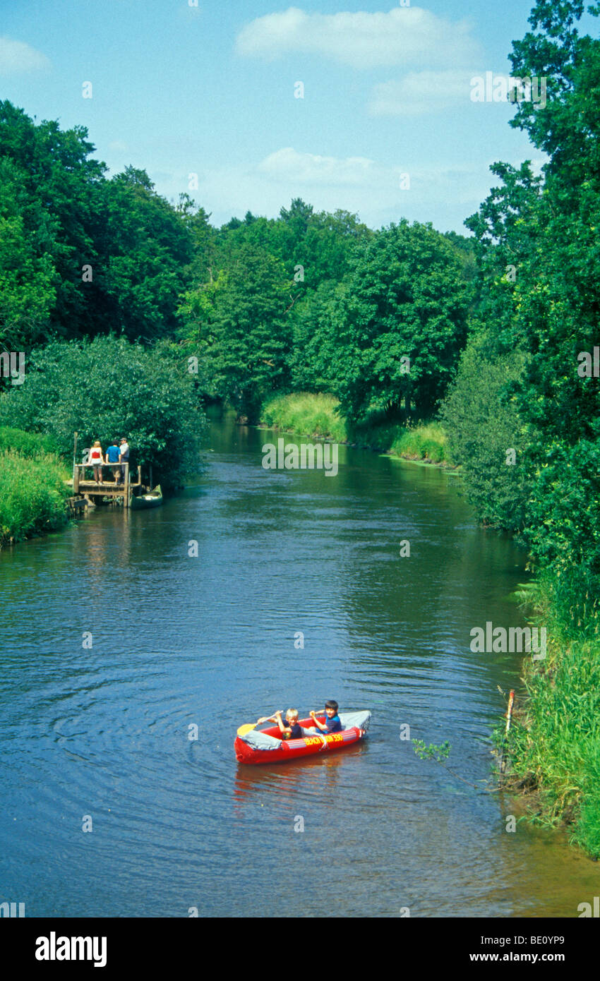 two young boys in a rubber dinghy on a river Stock Photo - Alamy