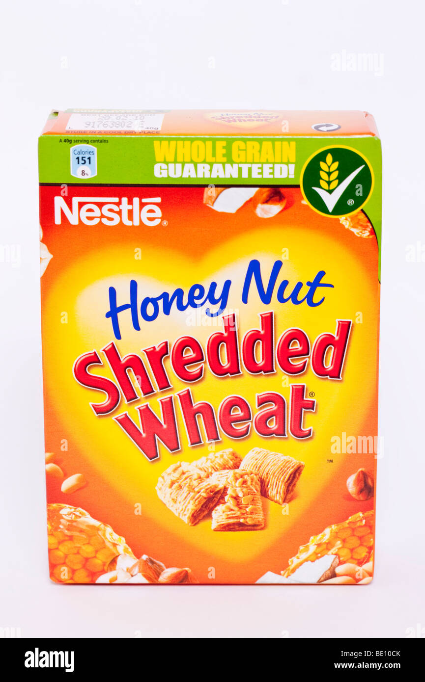A close up of a mini packet of Nestle honey nut shredded wheat cereal on a white background Stock Photo
