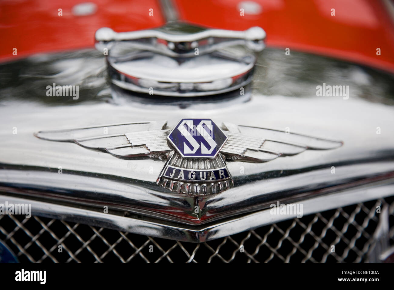 Front end of a Jaguar vintage Sports Car and Jaguar SS badge at the