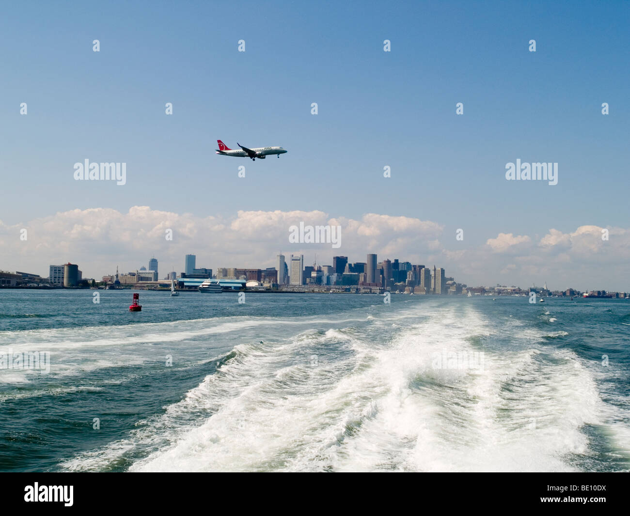 A plane coming in to land at Logan International Airport in Boston, Massachusetts USA Stock Photo