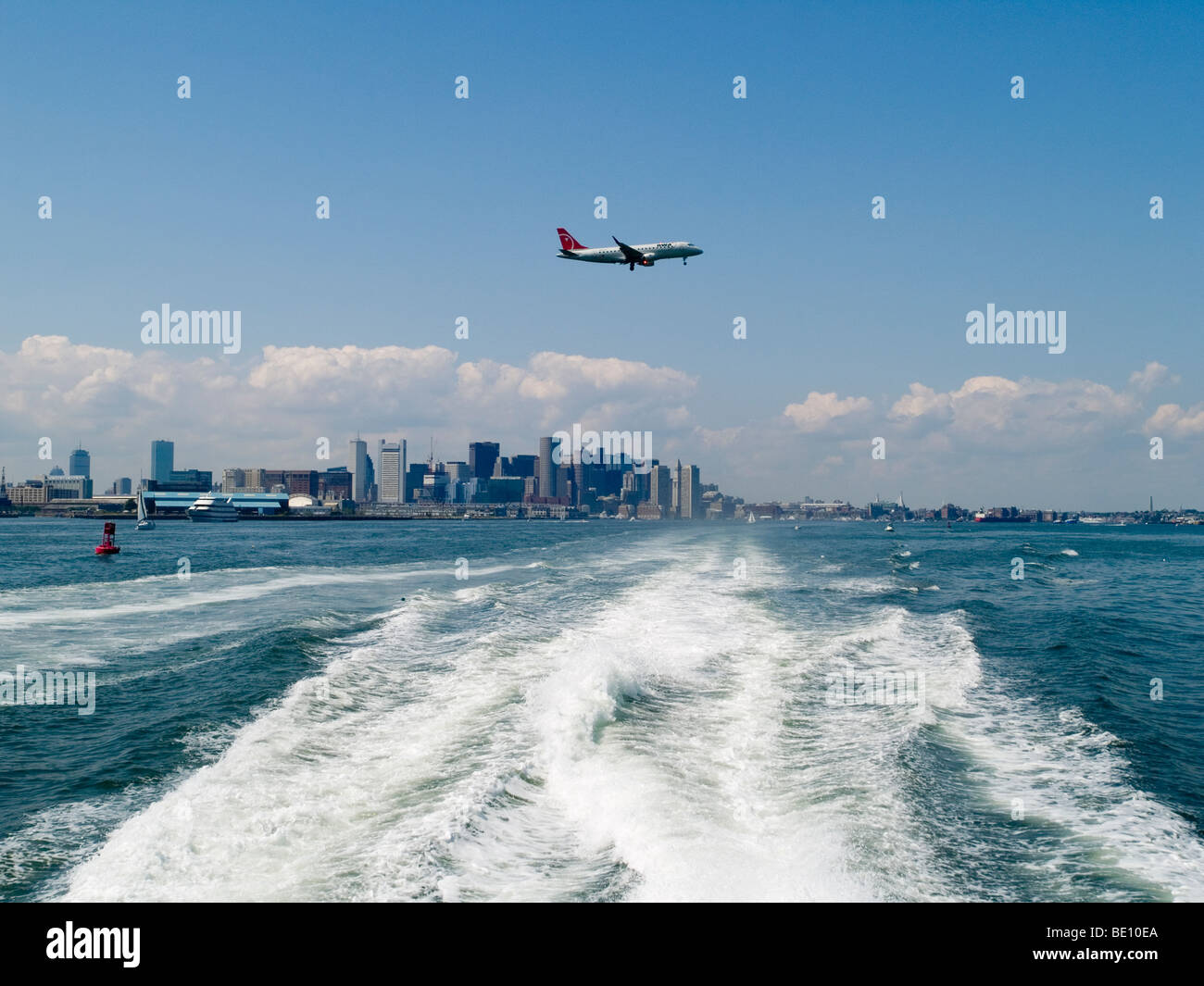 A plane coming in to land at Logan International Airport in Boston, Massachusetts USA Stock Photo
