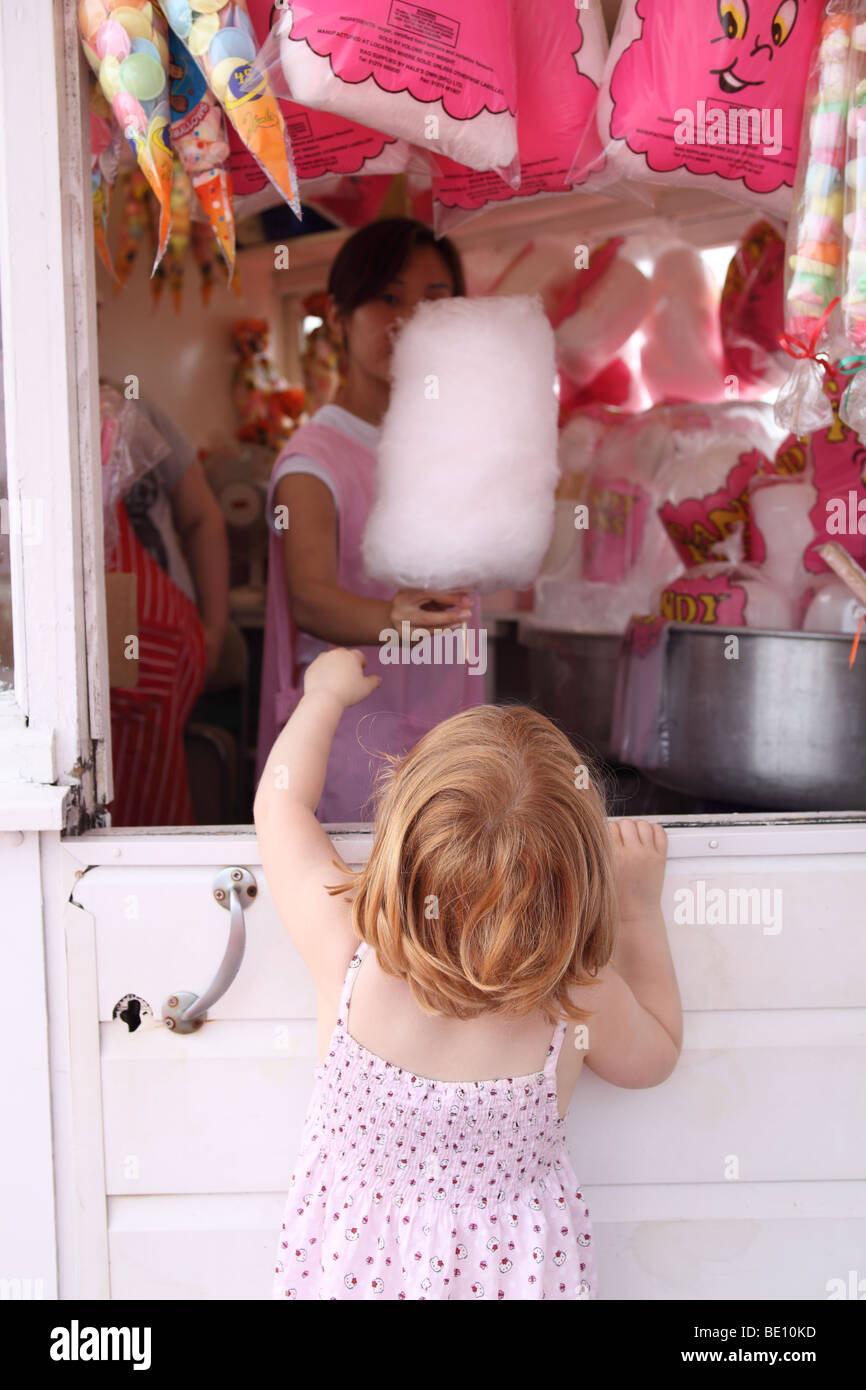 Girl at a sweet shop on Brighton Pier, Brighton, UK. Stock Photo