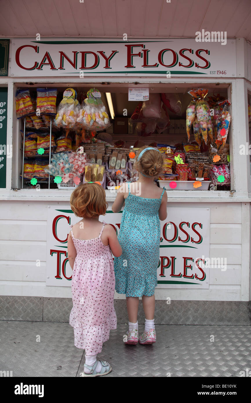 Girls at a sweet shop on Brighton Pier, Brighton, UK. Stock Photo