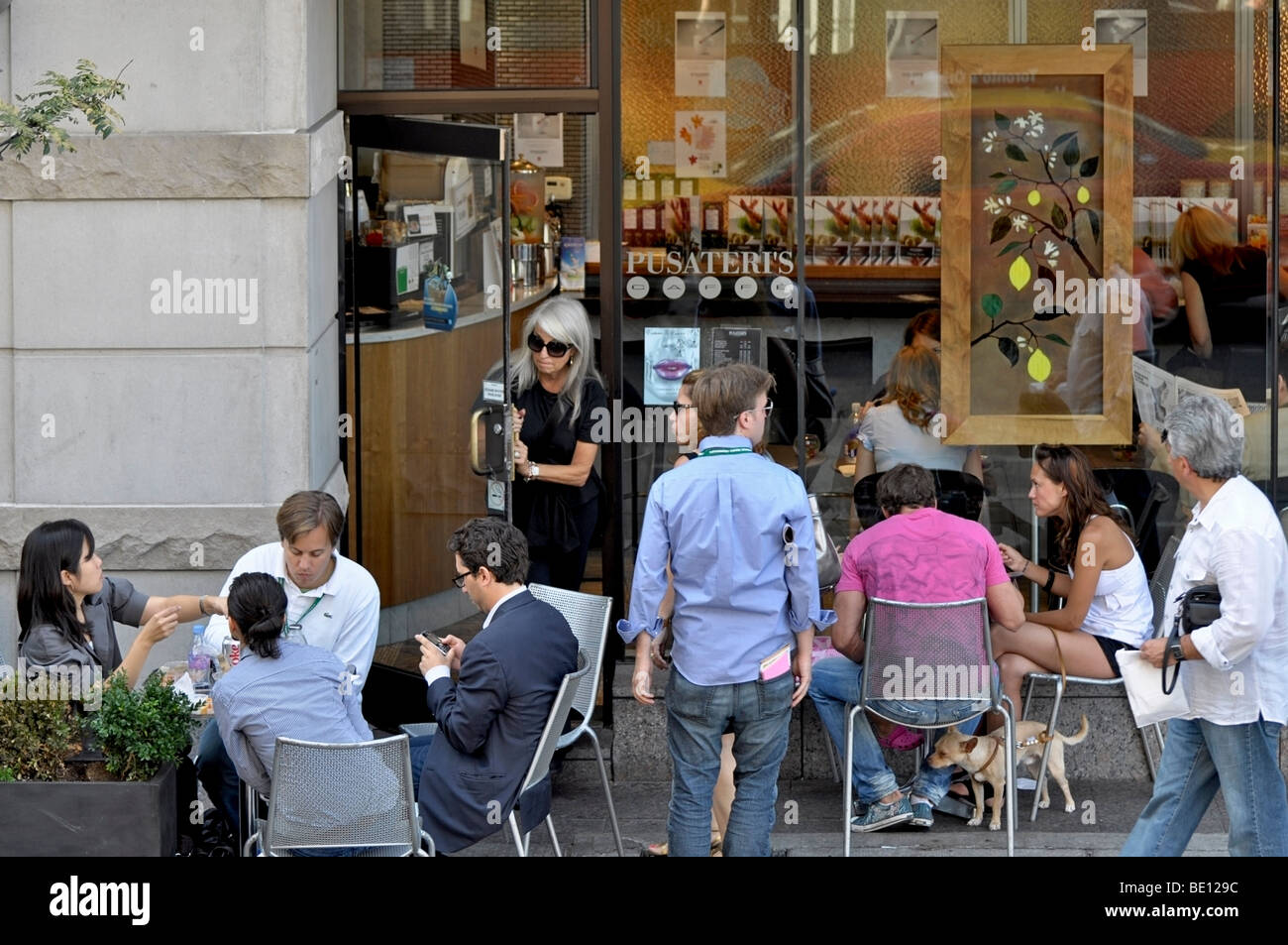 People dining/lunching outdoors on the Patio of Pusateri's Grocery Store - Yorkville, Ontario Stock Photo