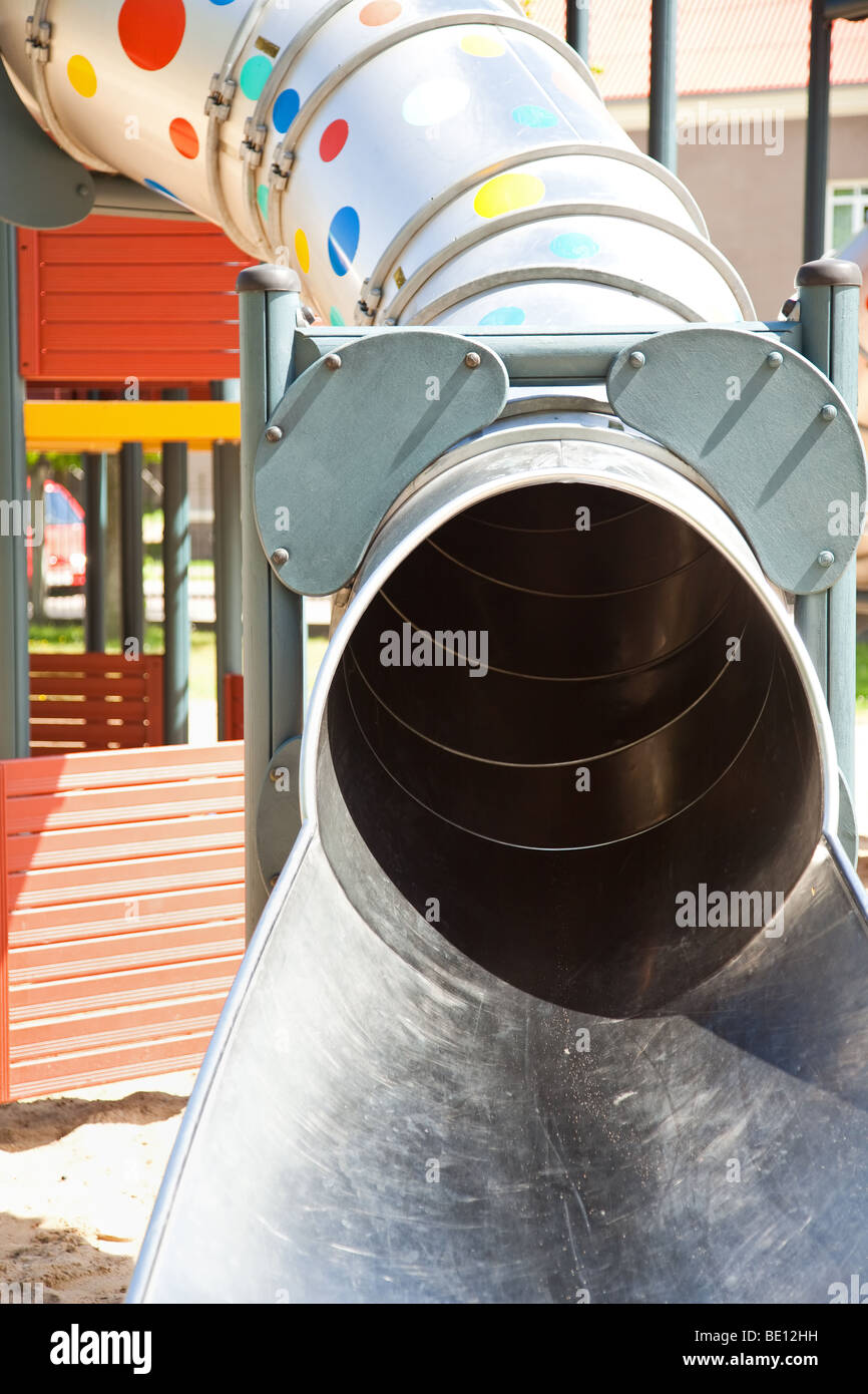 Jungle gym tube in children playground Stock Photo - Alamy