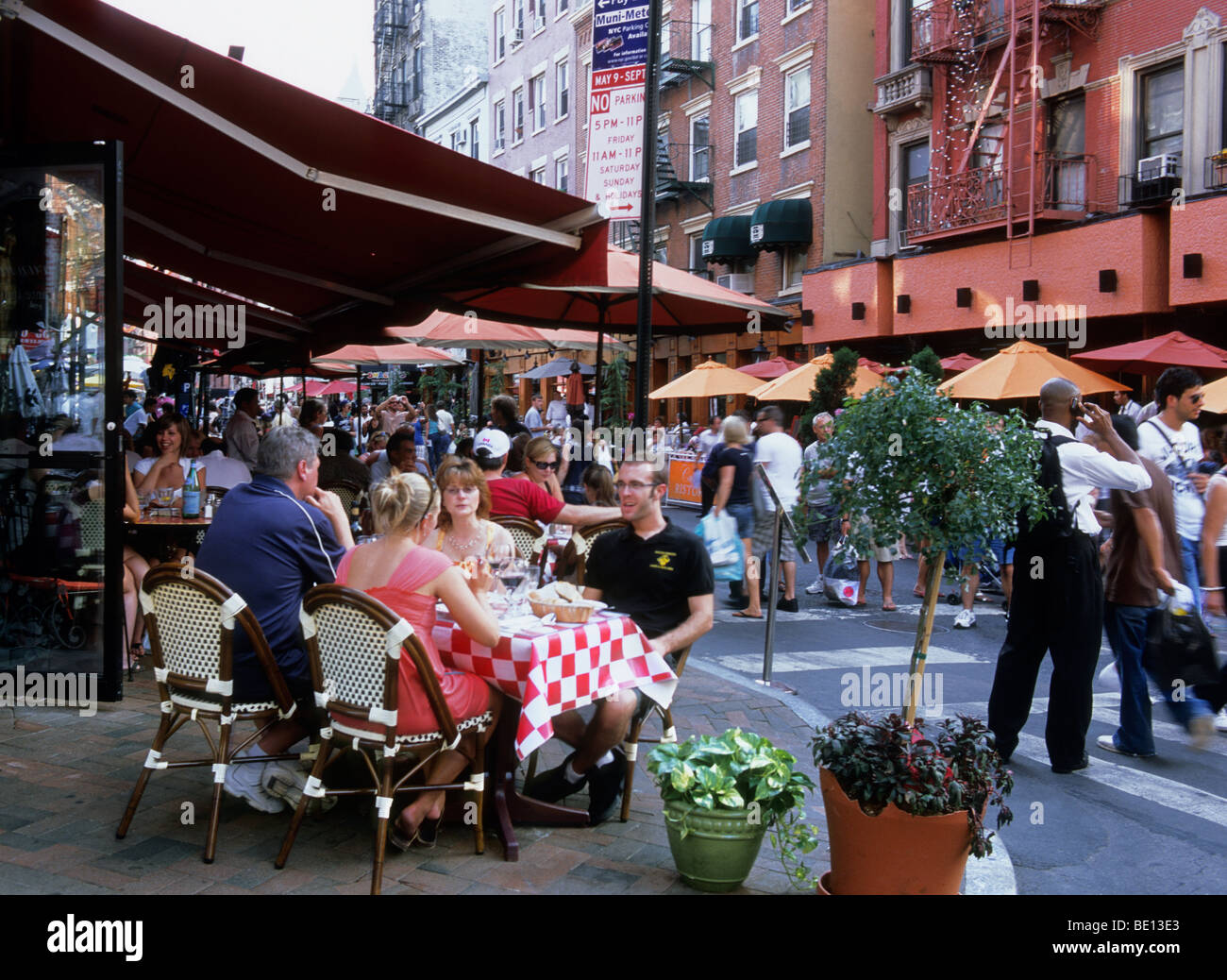 Little Italy, New York City, Lower East Side, Manhattan. Mulberry Street outdoor dining in an Italian restaurant on a summer evening. Stock Photo