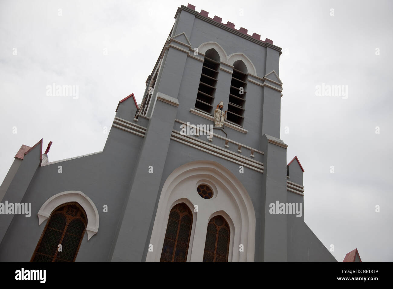 The Catholic Basilica in Ouidah, Benin sits across the street from the voodoo Temple of the Pythons. Stock Photo