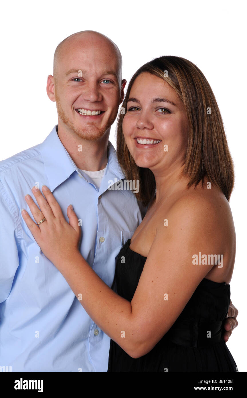 Young couple smiling isolated over a white background Stock Photo - Alamy