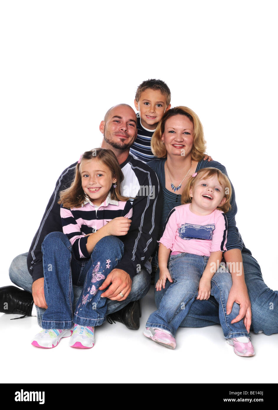 Family of husband and wife and three children Stock Photo