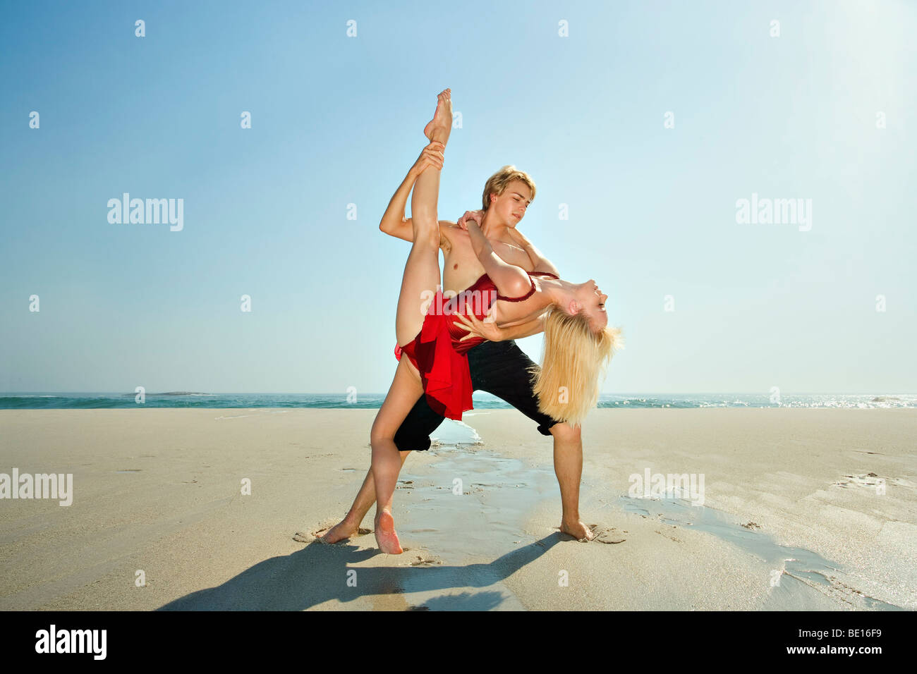 Couple dancing on a beach Stock Photo - Alamy