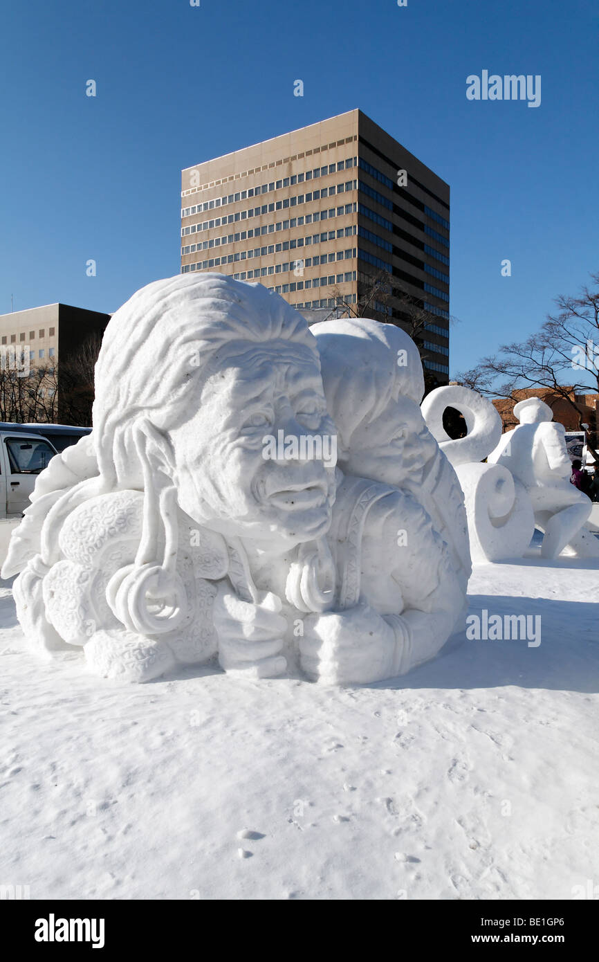 Native American woman with a child - snow sculpture at the Sapporo Snow Festival. Stock Photo