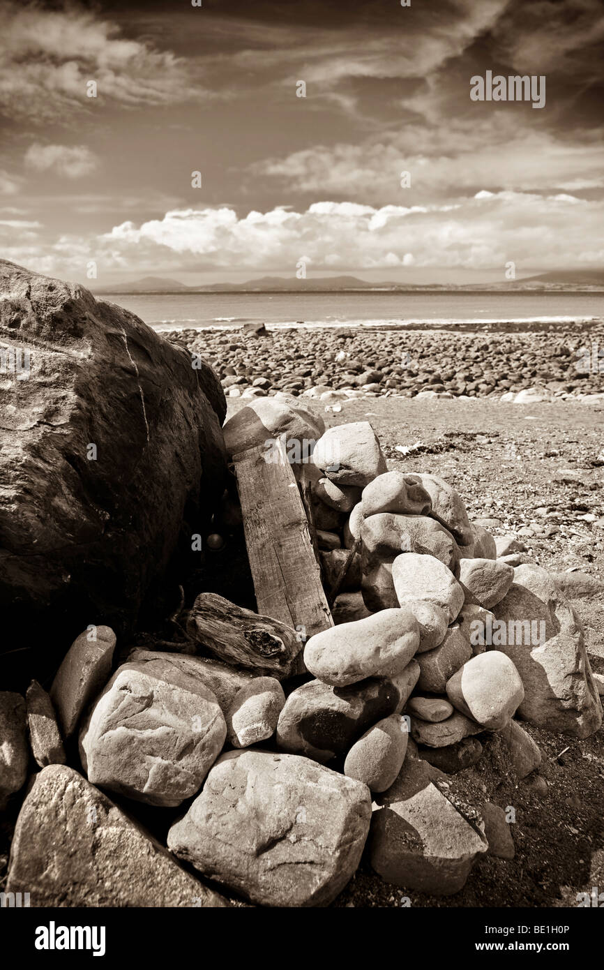 Landscape of beach focusing on rocks in B&W/sepia Stock Photo
