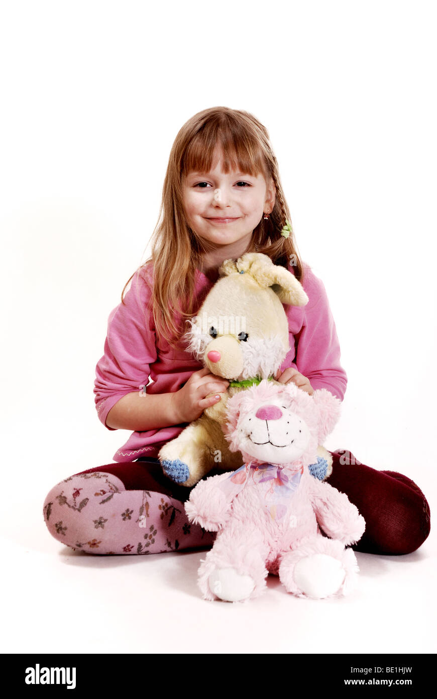 Girl with a toys Stock Photo - Alamy
