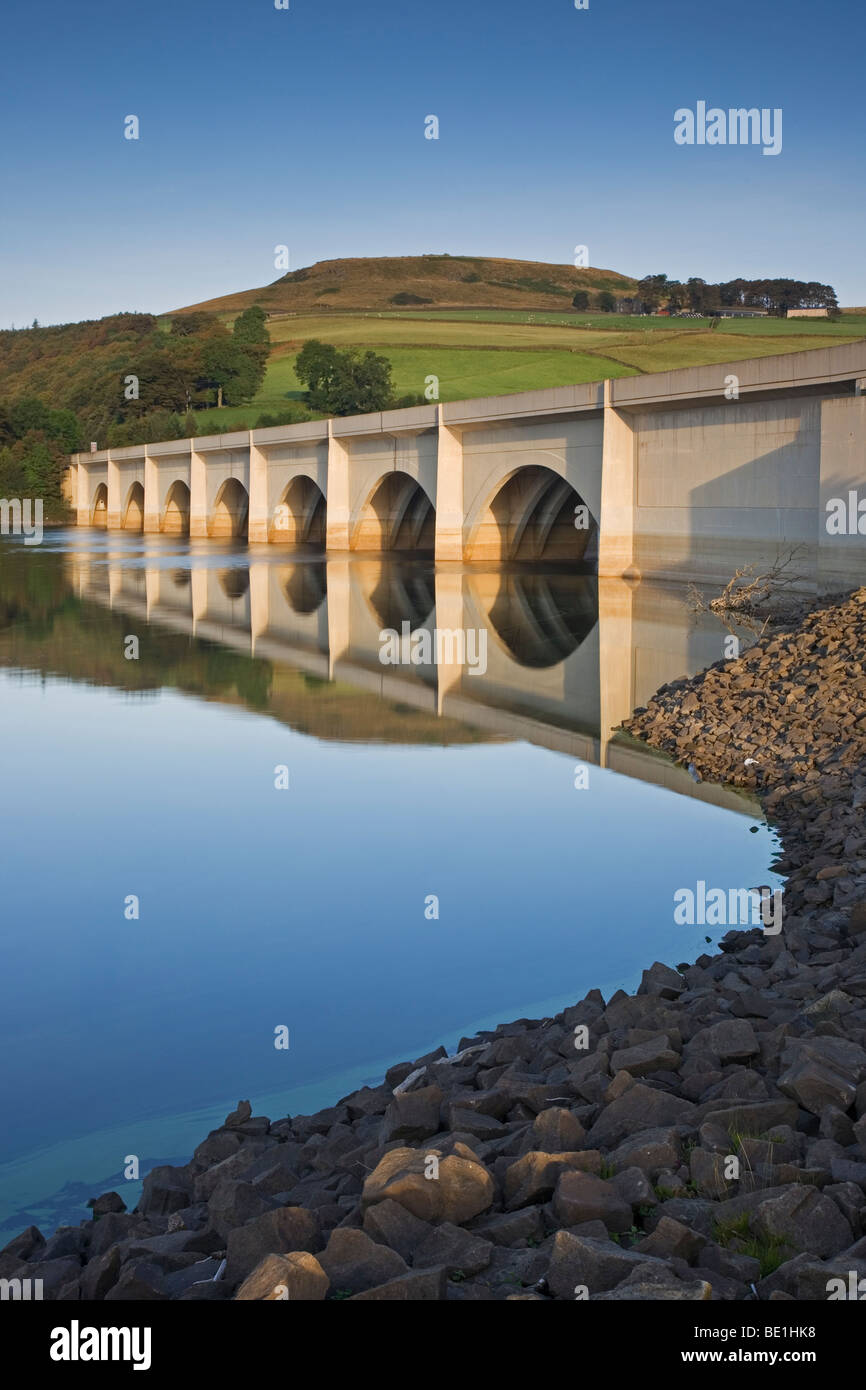 The Ashopton Viaduct, reflected in the still water of Ladybower Reservoir, one of the Derwent Dams at Ashopton, Derbyshire Stock Photo