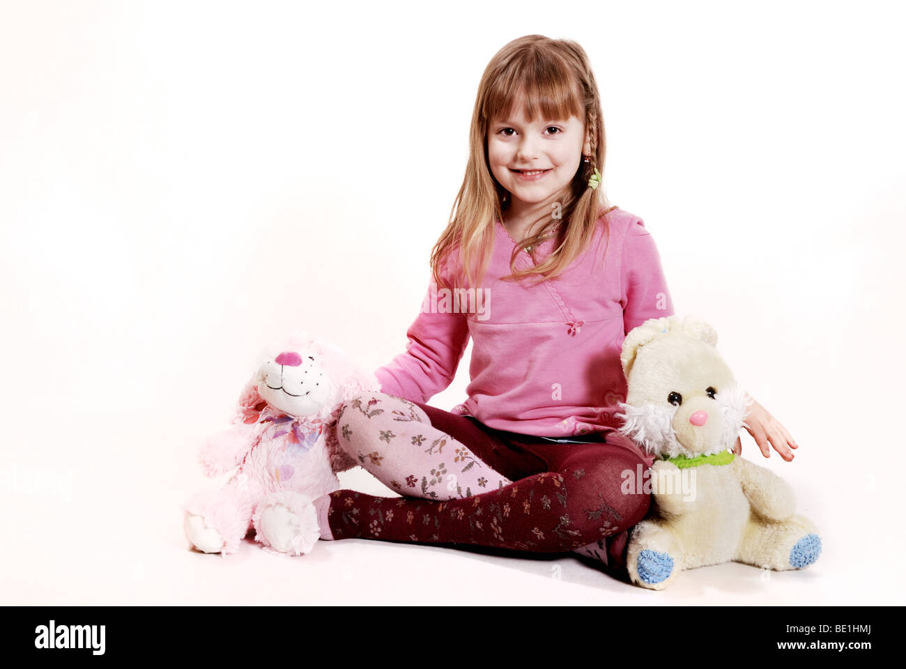Girl with a toys Stock Photo - Alamy
