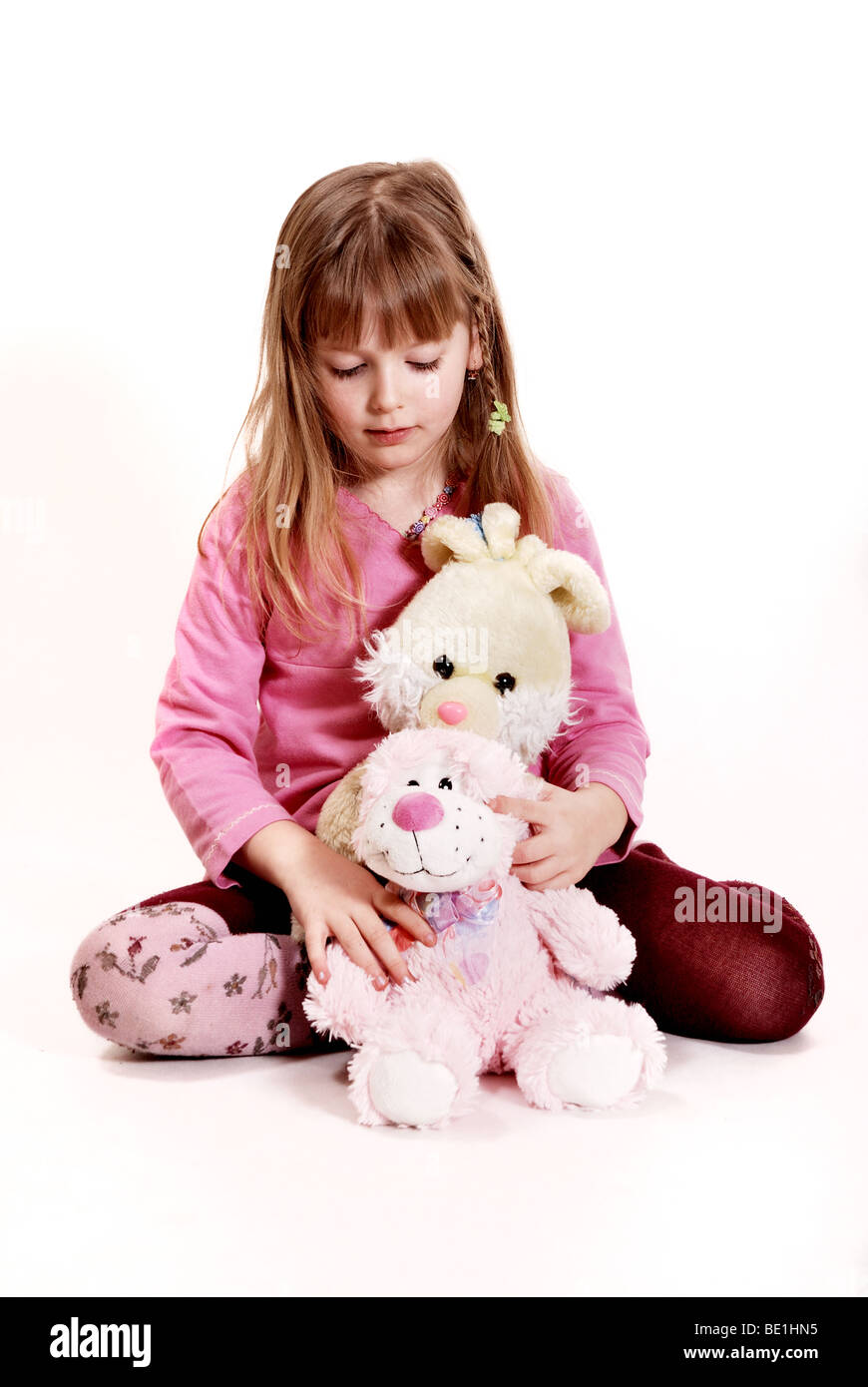 Girl with a toys Stock Photo - Alamy