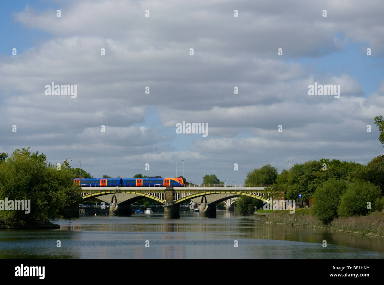 South West Trains Train Crossing The River Thames At Richmond Surrey England Stock Photo