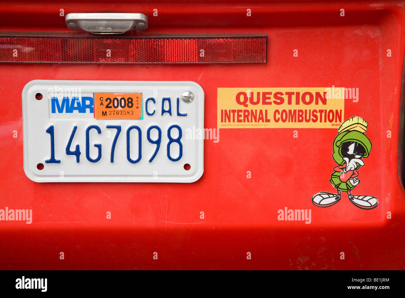 Question internal combustion bumper sticker on electric vehicle (CityEl three-wheel electric car). Palo Alto, California, USA Stock Photo