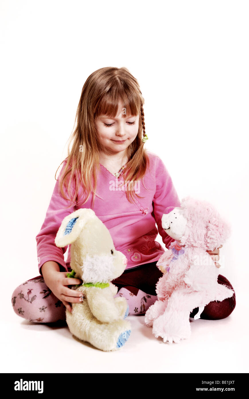 Girl with a toys Stock Photo - Alamy