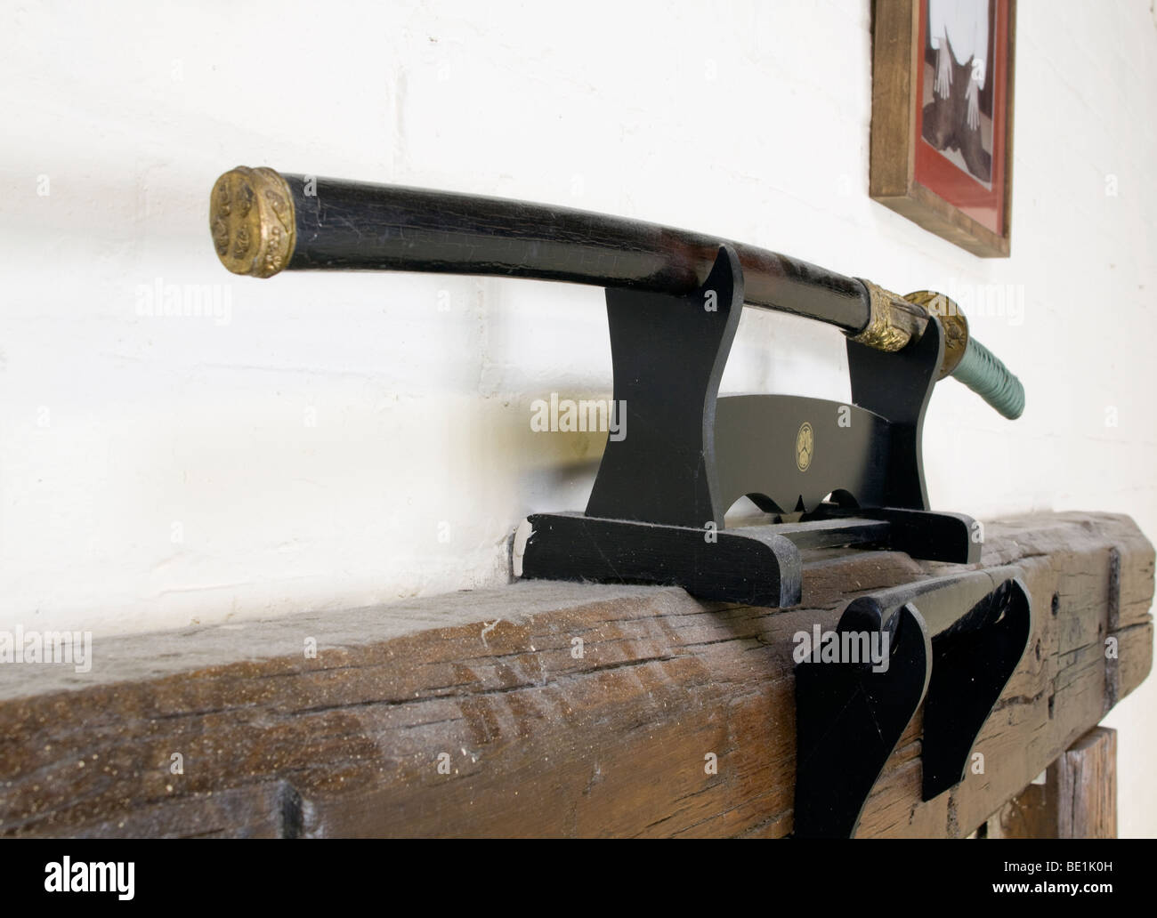 Japanese single edged sword katana in a kake kept in its scabbard (or