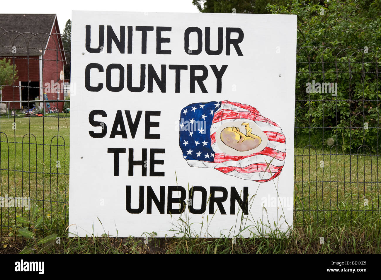 An anti abortion sign "Save the Unborn" fetus in a flag in Enterprise Oregon Stock Photo