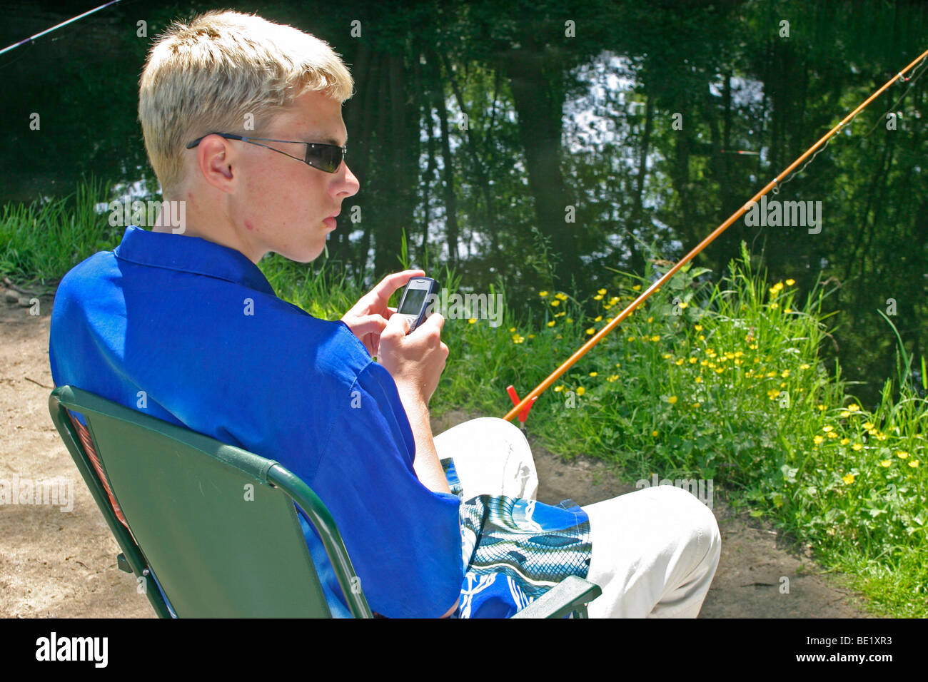 Teenage boy fishing river hi-res stock photography and images - Alamy