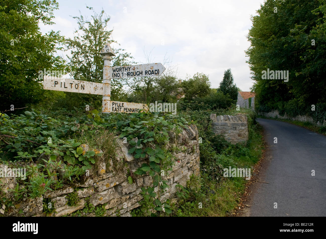 Country road sign in Pilton, Somerset, pointing to Worthy, where the Glastonbury Festival is sited each June. Stock Photo