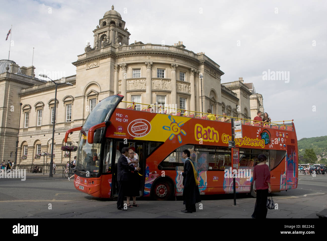 Sightseeing bus of Bath Spa collecting passengers outside the Guildhall