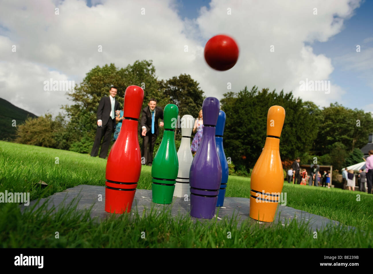 People playing lawn skittles at a wedding reception, UK Stock Photo