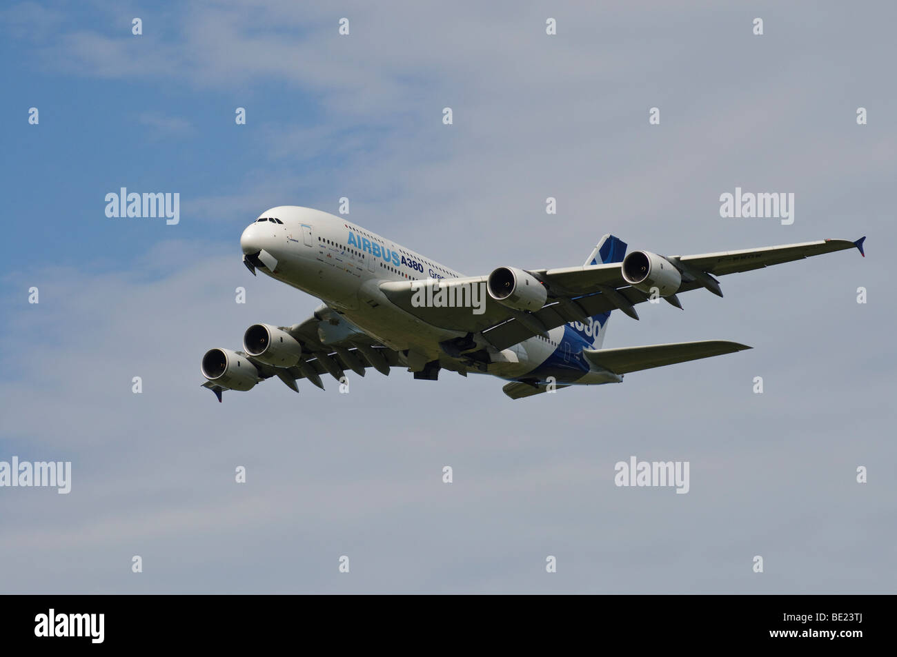 Airbus A380 in flight, about to deploy landing gear Stock Photo