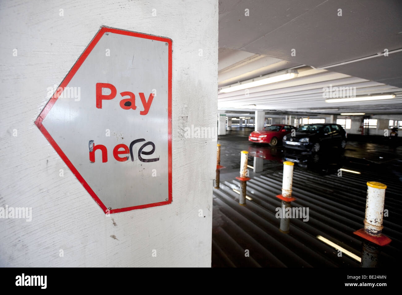 A pay here sign in a multi storey car park, Birmingham, England, UK Stock Photo Alamy
