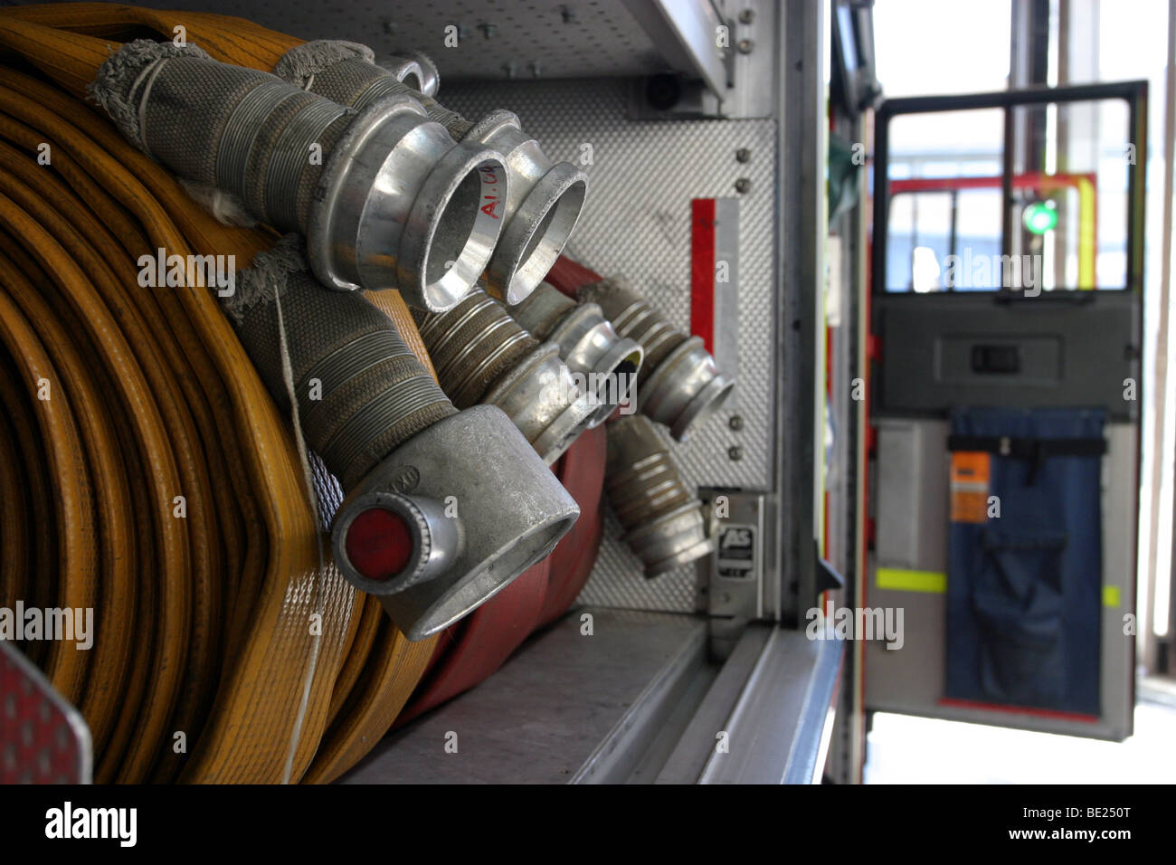 Hoses and reels in fire engine Stock Photo - Alamy