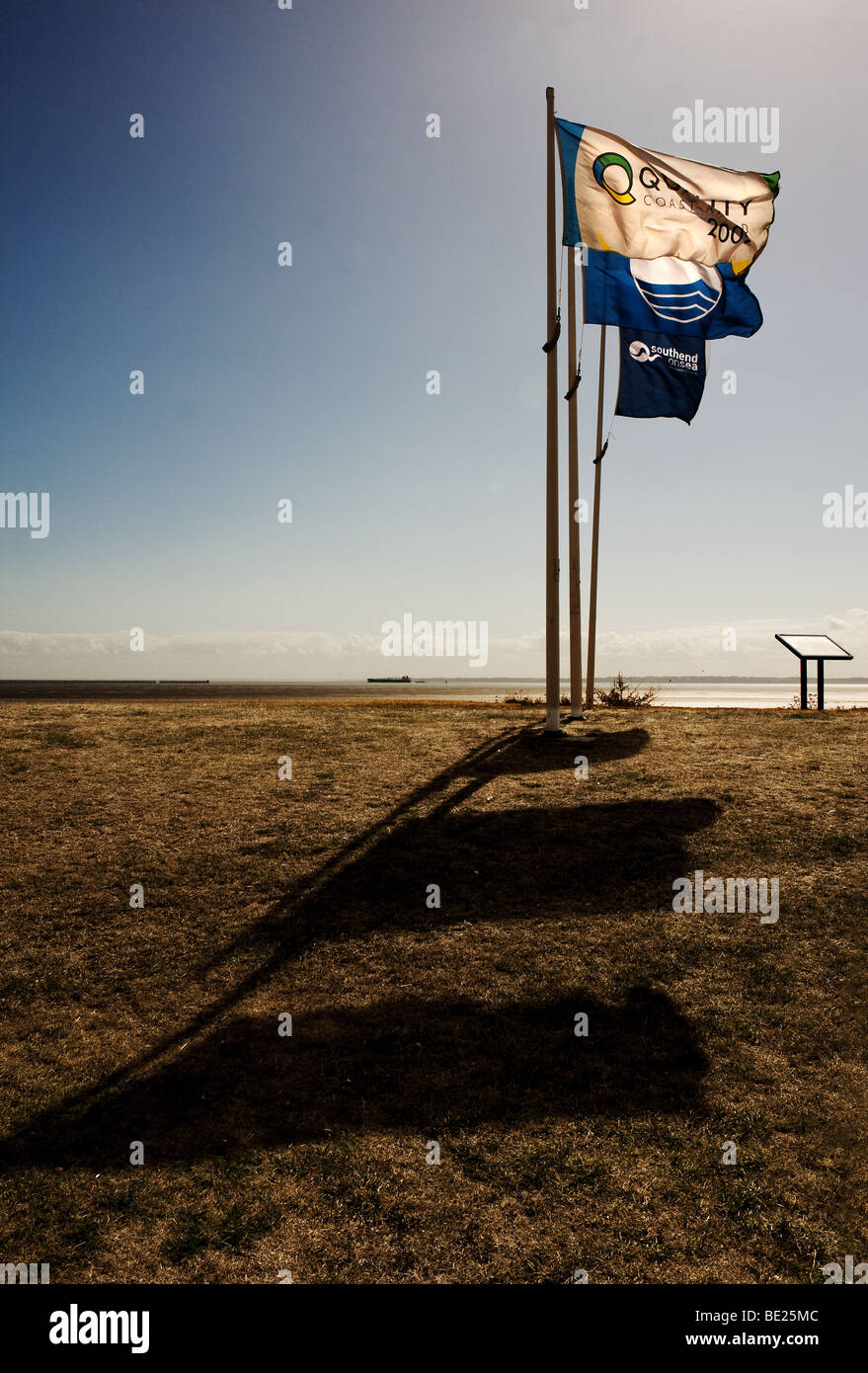 Three flagpoles on East Beach at Shoeburyness in Essex.  Photo by Gordon Scammell Stock Photo