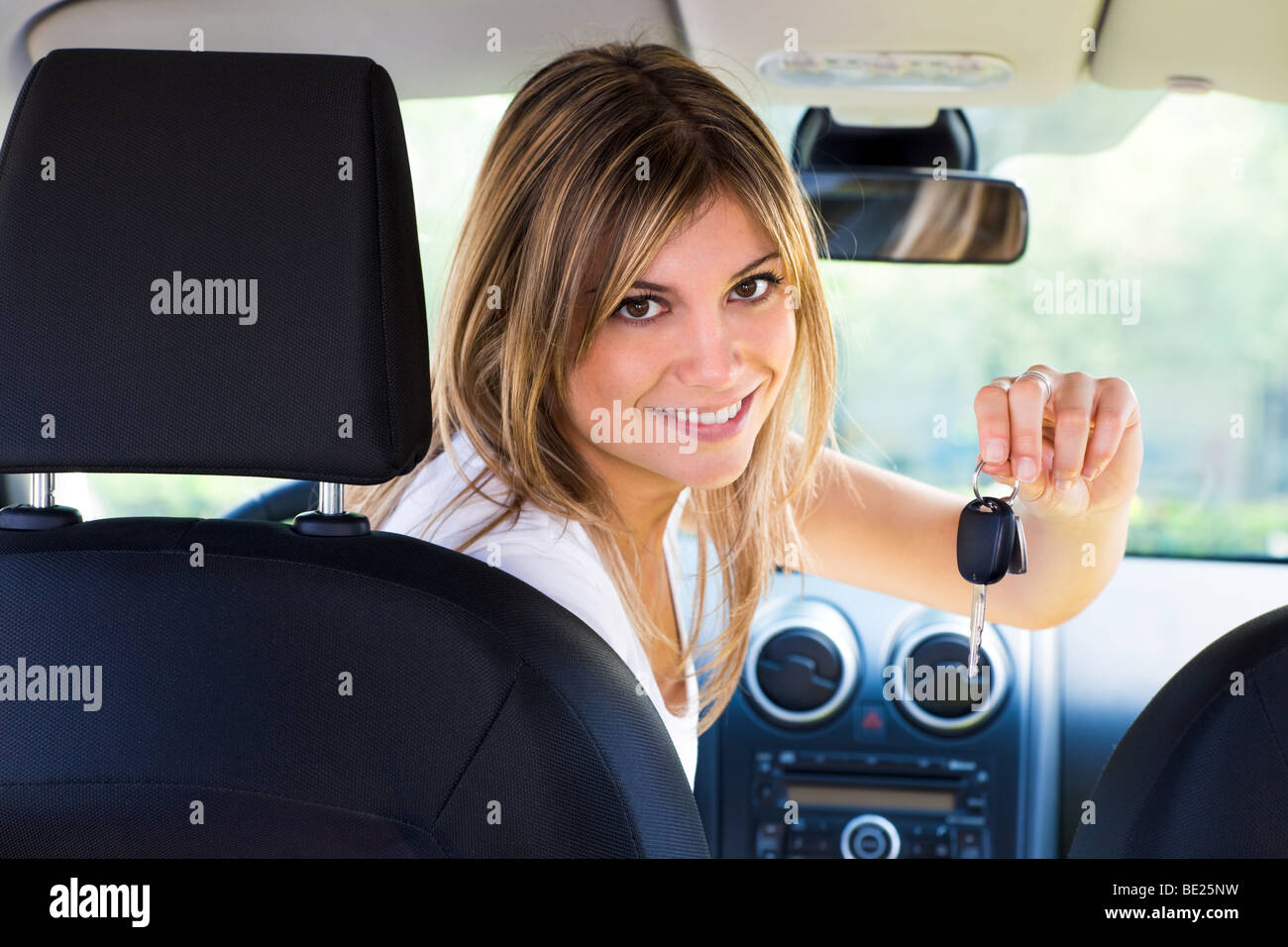 Keys Rear View rear view of woman holding keys to new car Stock Photo - Alamy