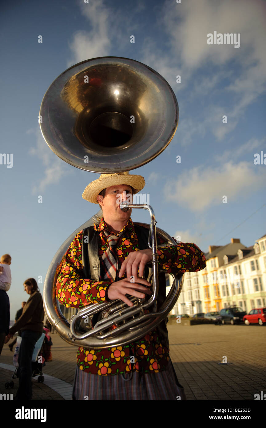 Man playing  sousaphone with the De Propere Fanfare belgian marching band performing on the promenade, Aberystwyth Wales UK Stock Photo