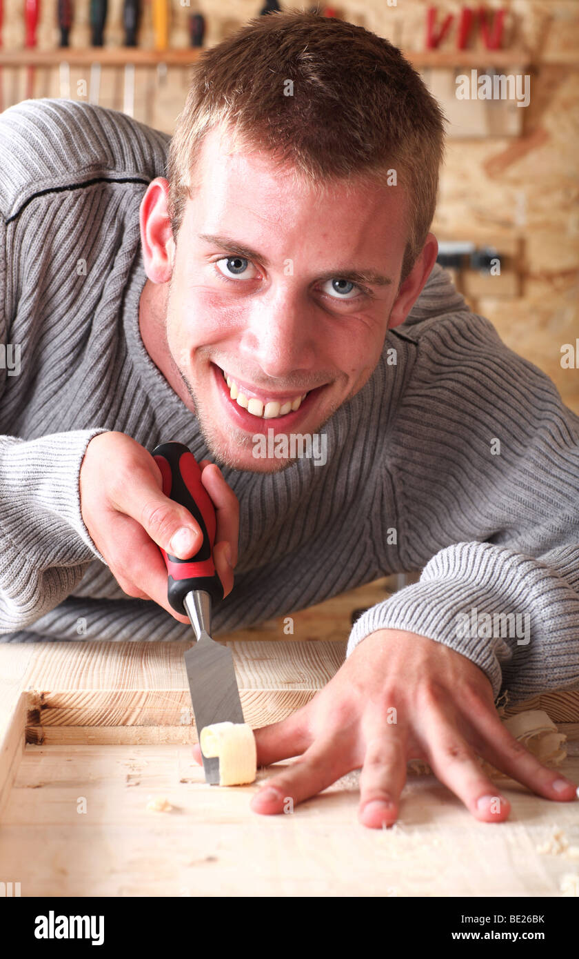 Portrait of carpenter chiseling with chisel Stock Photo Alamy