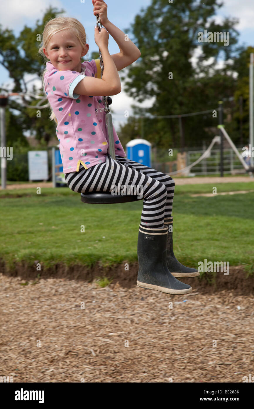 Young girl on zip wire at exciting new playground Broadway Activity Park Worcestershire UK Stock Photo